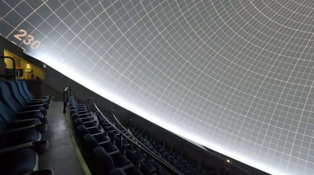 Inside view of MOSI’s Digital Dome Theatre, showing the massive curved screen and immersive 8K projection.