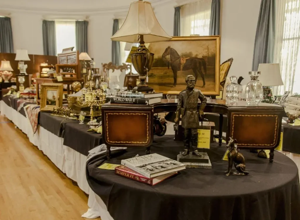 Silent auction table at Chiselers Market 2025 inside Plant Hall