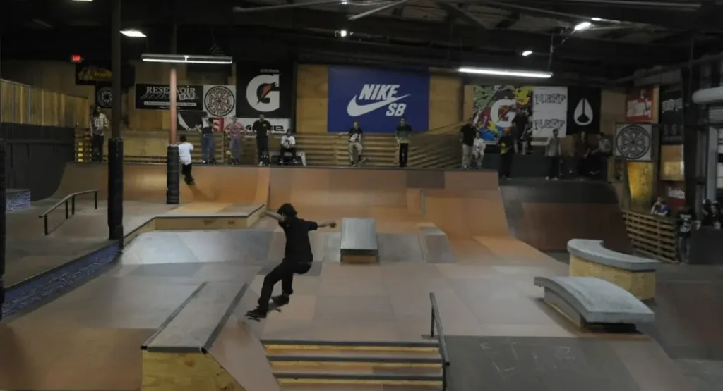 A pro skater mid-air during Tampa Pro 2024 Best Trick contest