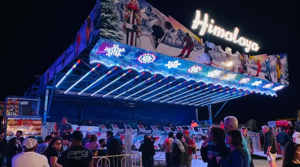 Festival rides at Sacred Heart in Pinellas Park with kids and families enjoying carnival fun