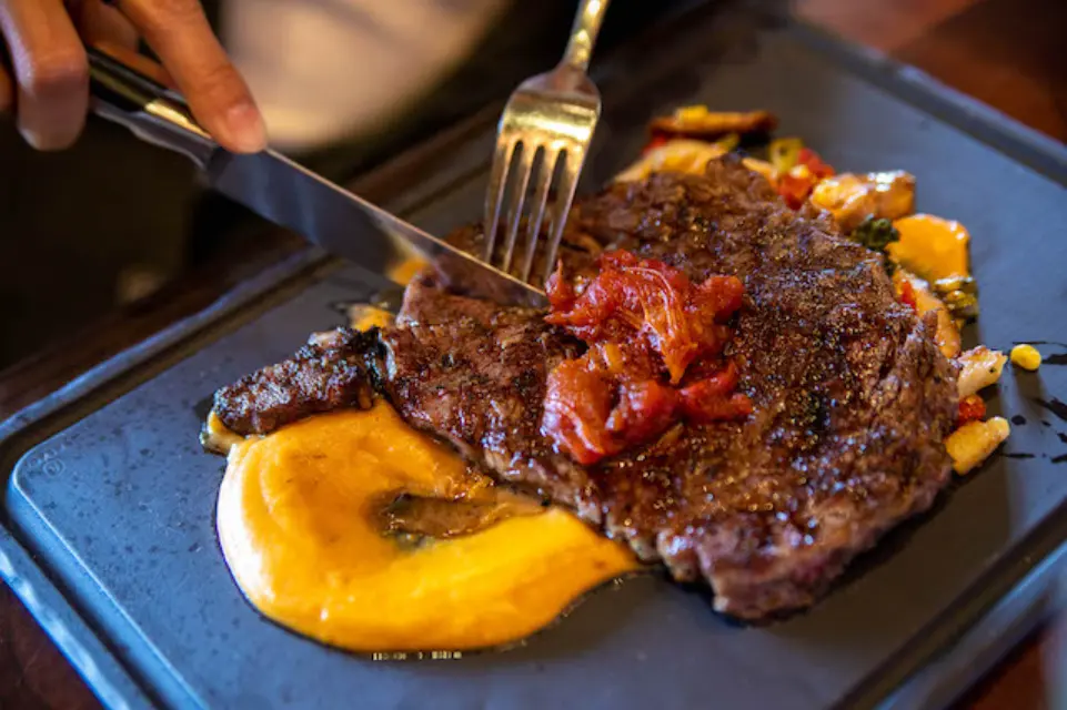 Flaming Tomahawk steak served at The Meat Market Tampa