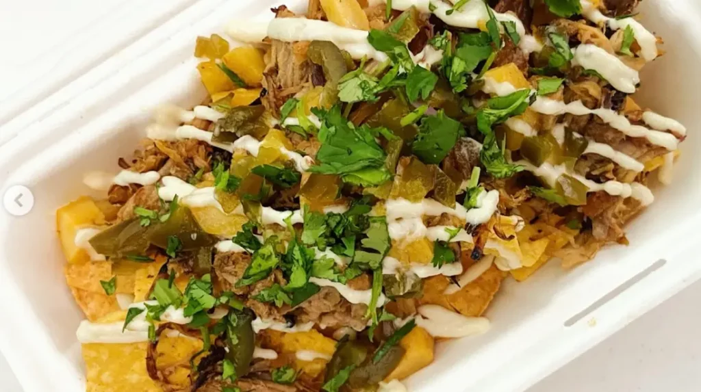 Community members receiving meals from Masa Food Truck