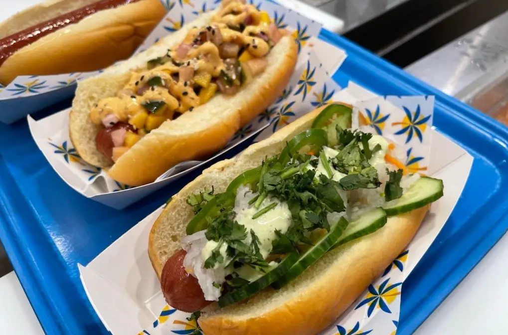 Three top Tampa hot dogs side by side
