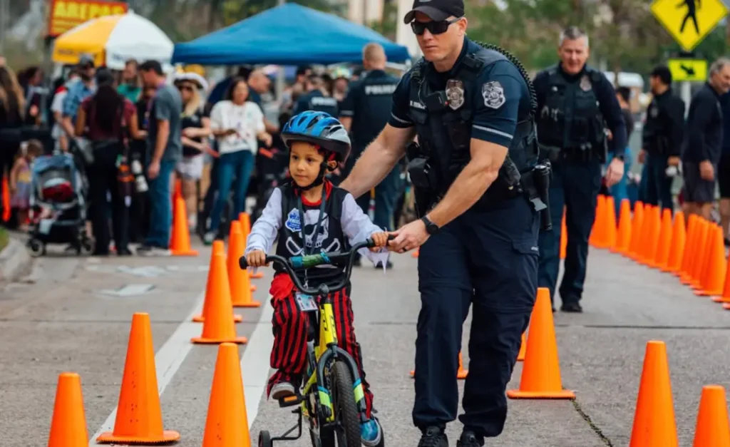 A lively parade scene featuring pirate floats and families enjoying 2026 Children’s Gasparilla.